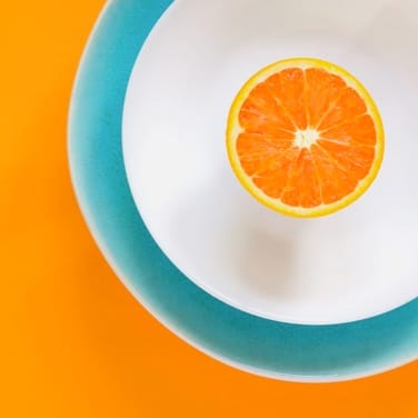 Orange slice on a white and blue plate